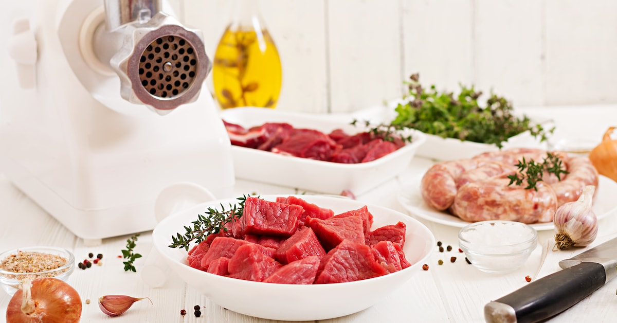 chopped-raw-meat-process-preparing-forcemeat-by-means-meat-grinder-homemade-sausage-ground-beef