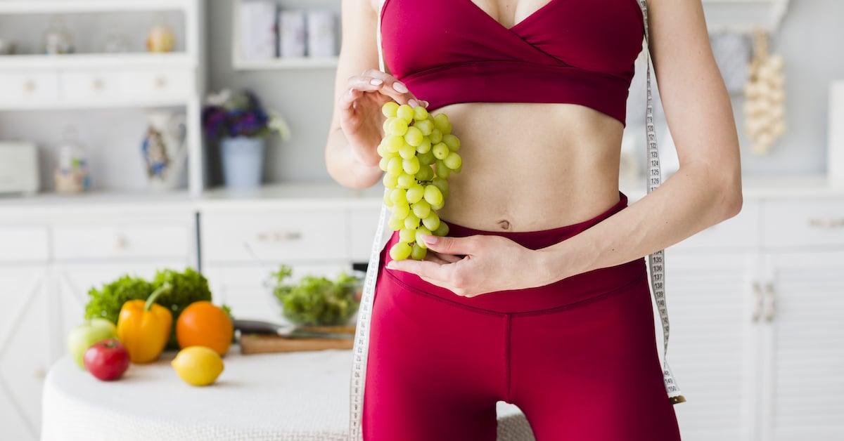 diet-concept-with-sporty-woman-kitchen