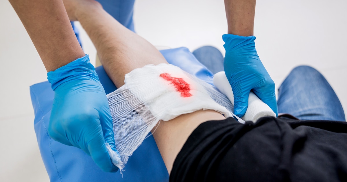 nurse-dressing-wound-patient-s-hand-with-deep-skin-cutting